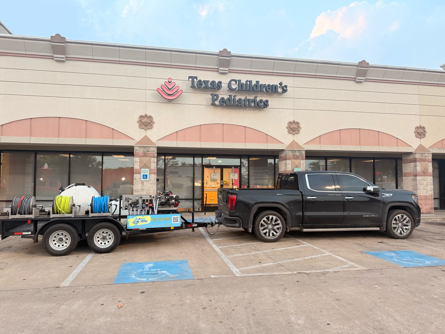 Zeal Power Washing truck and trailer setup with commercial pressure washing equipment for window and exterior cleaning services in Houston, TX